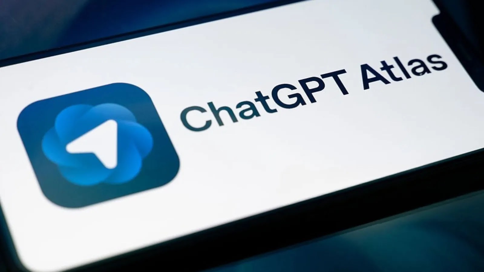 A smartphone screen displays the ChatGPT Atlas logo, featuring a blue icon with a white arrow, alongside the text ChatGPT Atlas on a white background.