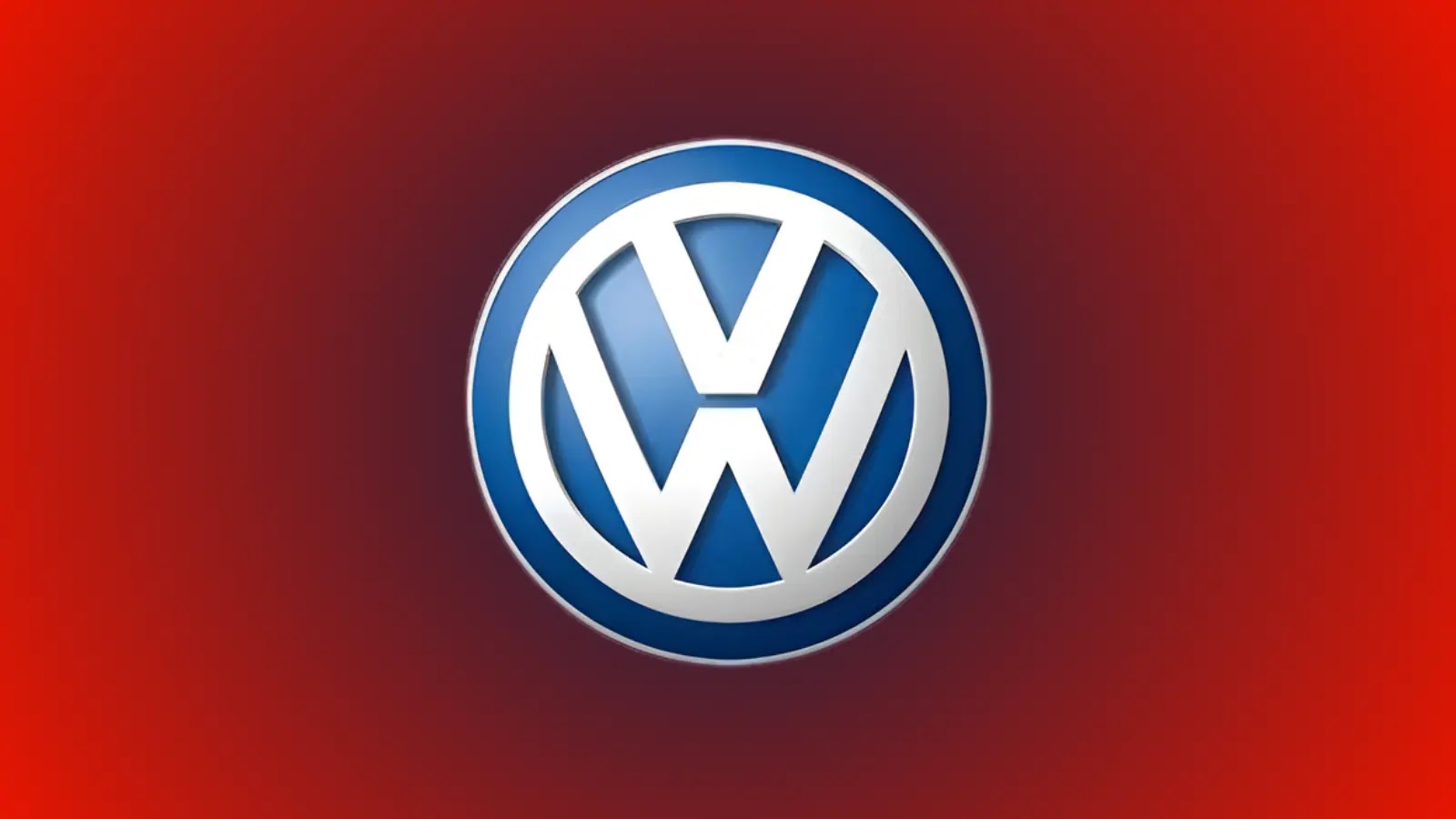 Volkswagen Allegedly Hit by Ransomware The Volkswagen logo, featuring a white V over a W within a blue circle, is centered on a vibrant red background.