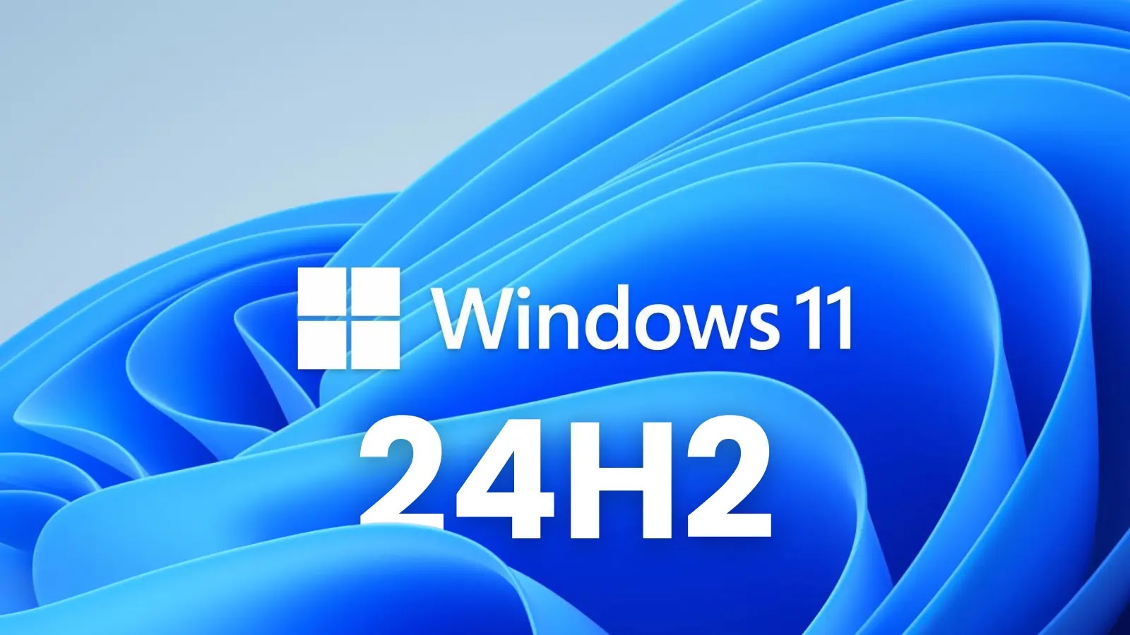 Blue abstract background with the Windows 11 logo and text that reads “Windows 11 24H2” in large white letters, indicating a version update for the operating system.