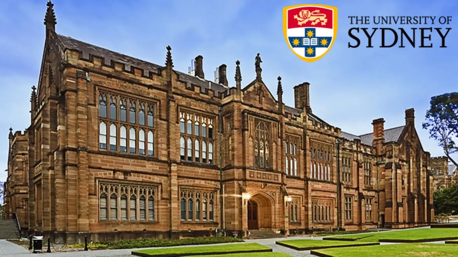 A large, historic sandstone building at the University of Sydney, featuring arched windows and Gothic architecture. The university’s name and crest are shown in the upper right corner.