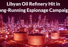 A brightly lit oil refinery at night with storage tanks and towers, overlaid with the text: Libyan Oil Refinery Hit in Long-Running Espionage Campaign.