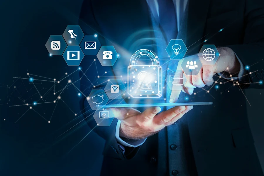 Simple_Network_Management_Protocol__SNMP_ A person in a suit holds a tablet with holographic icons and a glowing lock symbol, representing cybersecurity and data protection, while touching virtual icons related to technology and communication.