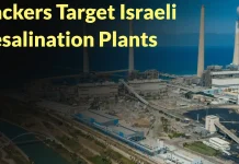 Aerial view of a large desalination plant by the sea with the text “Hackers Target Israeli Desalination Plants” written in yellow at the top of the image.
