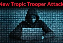 A person in a hoodie sits at a laptop, surrounded by digital code, with the text “New Tropic Trooper Attack” in bold red letters at the top.