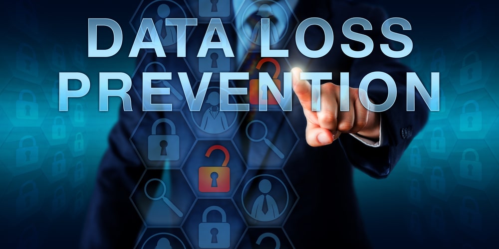 data-loss-prevention-1 A person in a suit points at the words DATA LOSS PREVENTION over a digital screen with lock icons, representing cybersecurity and data protection concepts.