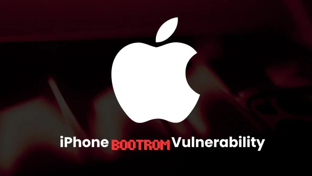 iPhone-BootROM-Vulnerability-1024×576 The image shows the Apple logo above the words “iPhone Bootrom Vulnerability,” with “Bootrom” appearing in red, glitchy text, against a dark blurred background.