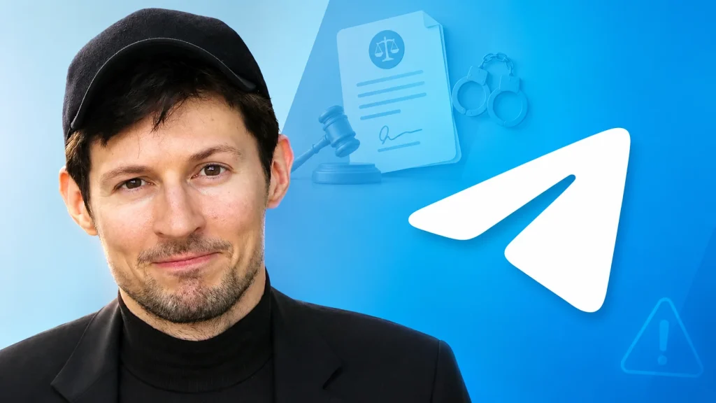 Russia-Charges-Telegram-CEO-Pavel-Durov-1024×576 A man in a black cap and jacket stands in front of a blue background with the Telegram logo and legal icons like a gavel, handcuffs, and a document.
